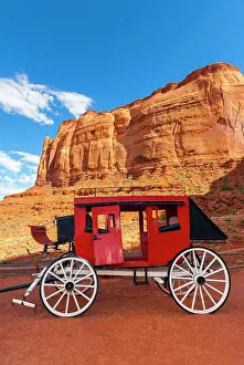 Table: Historic carriage at Monument Valley, cloudy sky
