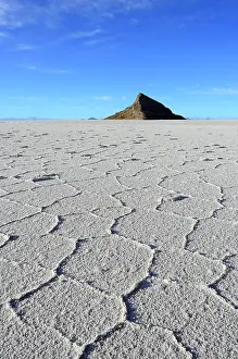 Salar: Honeycomb structure on the salt lake, rocky island