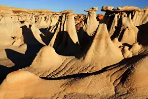Amidst: Hoodoos - eroded clay sculptures with rocks balanced