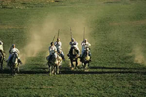 Attacks: Horsemen riding in an equestrian fantasia in Morocco