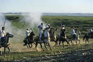 Attacks: Horsemen riding in an equestrian fantasia in Morocco