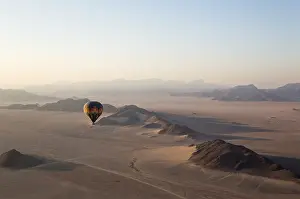 Balloon: The hot-air balloon above an arid plain and isolated