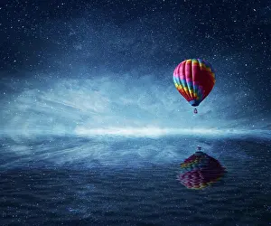Ride: Hot air balloon flying over the a cold dark blue