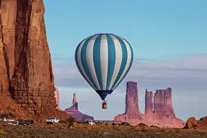 Ride: A hot air balloon flying in front of the Utah Monuments