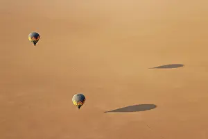 Remote: Two hot-air balloons above an arid plain at the edge of the Namib Desert