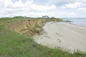 Destructive: Houses on edge of severely eroded cliffs