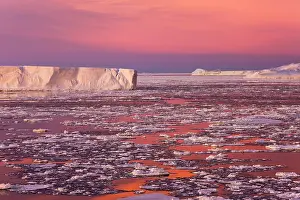 Tabular: Huge iceberg and ice floes in the ocean