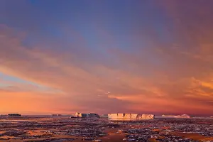 Floes: Huge iceberg and ice floes in the ocean