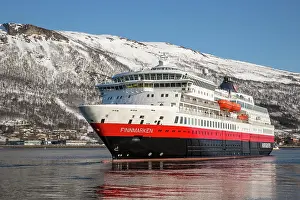 Navigation: Hurtigruten vessel MS Finnmarken leaves port, Tromsc