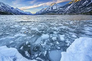 Alberta: Ice floating on the surface of Waterton Lake as it starts to freeze with the onset of winter