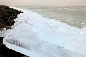 Pieces: Ice forming pushing up against dikes