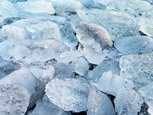 Cemetery: Iceberg on black volcanic beach. North Atlantic
