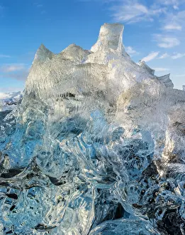 Cemetery: Iceberg on black volcanic beach. North Atlantic
