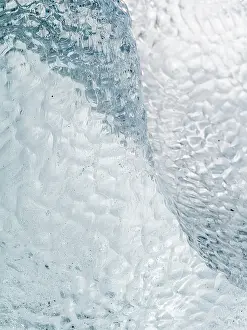 Cemetery: Iceberg on black volcanic beach. North Atlantic