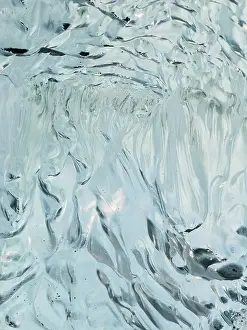 Cemetery: Iceberg on black volcanic beach. North Atlantic
