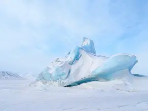 Abandoned: Iceberg in the frozen Mohnbukta in Sabine-Land. The island