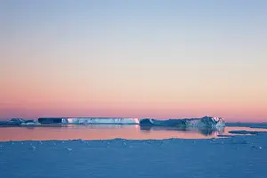 Tabular: Iceberg in the ocean at sunrise, Antarctica