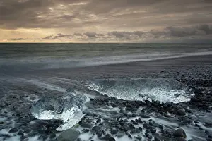 Deposits: Icebergs on beach at night