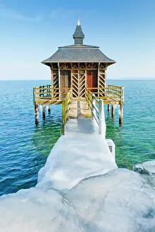Wooden: Iced wooden bathhouse in sunshine and blue sky on