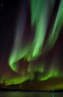 Bizarre: Iceland. Northern Lights over fjord Isafjardardjup near