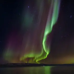 Bizarre: Iceland. Northern Lights over fjord Isafjardardjup near