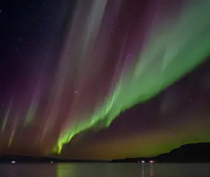 Bizarre: Iceland. Northern Lights over fjord Isafjardardjup near