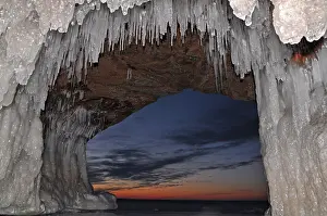 Lakeshore: Icicles and ice formations in a cave hanging from
