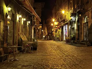 Gastronomy: Illuminated Old Town lane at night, with restaurants