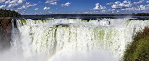 Chain: Impressive panoramic view of a chain of waterfalls under a cloudy sky