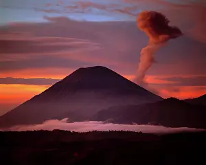 Eruption: Indonesia. Mt. Semeru emits a plume of smoke