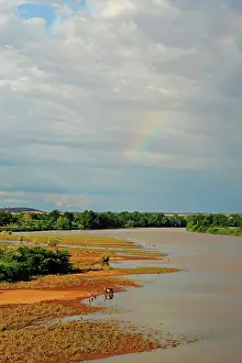 Amid: Inland Madagascar. Red river amid vegetation