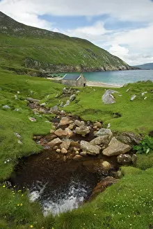 Shack: Ireland, Achill Island. A stream runs down