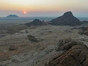 Eroded: The isolated Spitzkoppe mountain (1728 m) - on the right - majestically rises above the surrounding desert plains