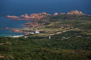 Isola: Italy, Sardinia, Isola Rossa. Red rock coastline