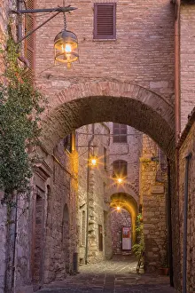 Julie: Italy, Umbria, Assisi. Alleyway with arches and