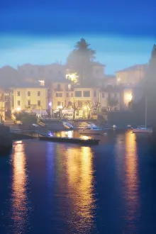 Dock: Italy, Varenna. Misty evening dock scene