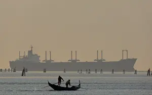 Cargo: Italy - Venice lagoon - Gondola and cargo ship