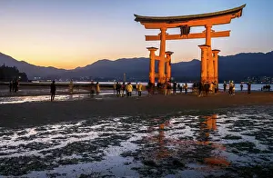 Torii: Itsukushima Shrine, Torii Gate at low tide at sunset