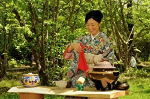 Ceremonies: Japanese woman performing a tea ceremony in the