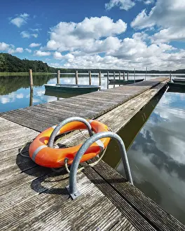 Boats: Jetty with rowing boats at Moderfitzsee under a blue sky