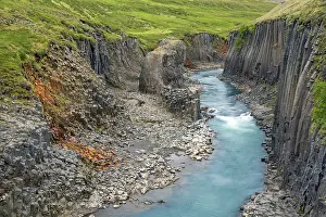 Basalt: Jnkla glacial river and basalt columns, volcanic rock format