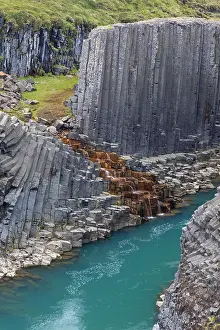 Basalt: Jnkla glacial river and basalt columns, volcanic rock format