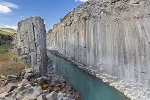 Basalt: Jnkla glacial river and basalt columns, volcanic rock format