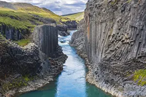 Basalt: Jnkla glacial river and basalt columns, volcanic rock format