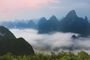 Yangshuo: Karst hills in morning mist, Li River area
