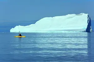 Kayak: Kayaker tourist kayaking between melting