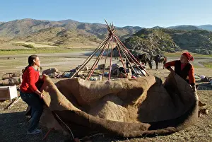 Brian Mcdairmant: Kazakh herders erecting tent on there journey to