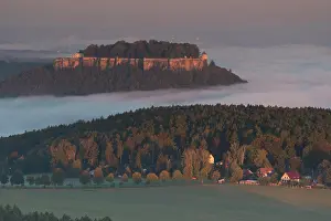 Saxon: Knnigstein Fortress above the morning mist at sunrise