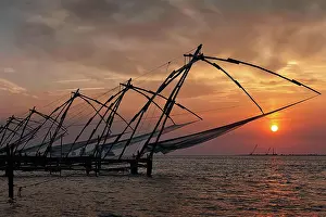 Rope: Kochi tourist attraction, chinese fishnets on sunset