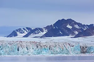 Calving: Kongsbreen glacier in autumn, fall, calving into Kongsfjorde